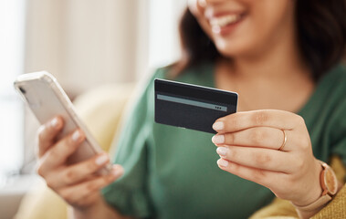 Phone, credit card closeup and woman hands with online shopping and banking at home. Ecommerce,...