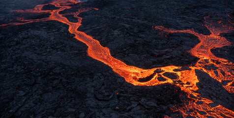 Aerial view of spreading melted lava from volcano.