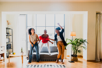 Beautiful and young latin american women having fun and bonding at home - Three pretty hispanic adult female spending time together 