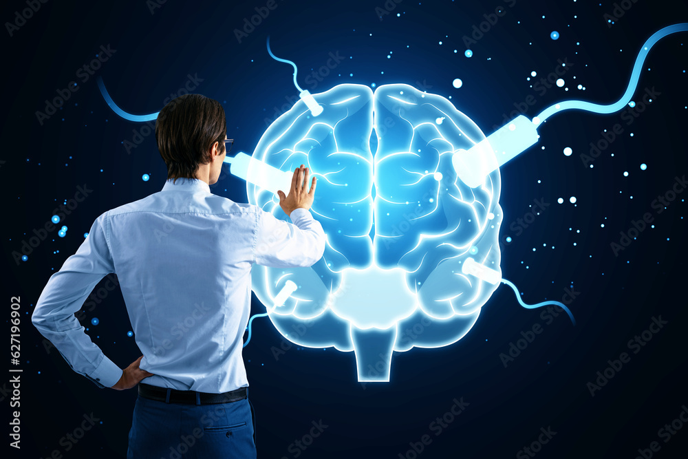 Poster back view of young businessman using tablet with glowing connected brain hologram on blurry blue bac