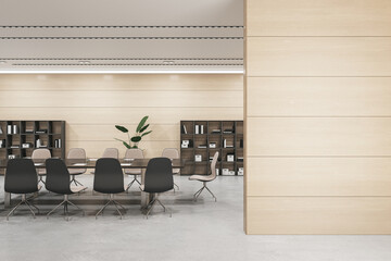 Front view of blank wooden wall with empty place for poster or frame and modern negotiant office...