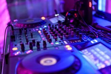 Professional DJ Equipment sound and audio mixer control panel with buttons and sliders