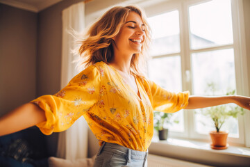 Positive white woman dancing at home. Happiness and well being concept.