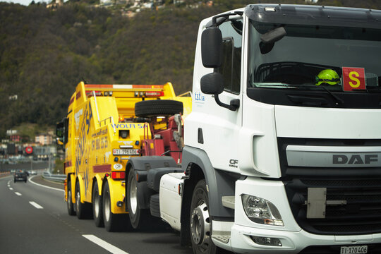 13.04.2023 Switzerland, Europe. Truck Towing Truck: Roadside Assistance on the European Highway
