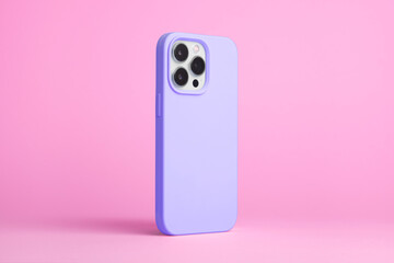 smart phone in purple case back side view isolated on pink background, iPhone 15 Pro case mock up
