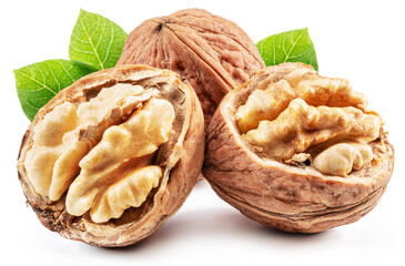 Whole walnut and walnut kernel  with leaves isolated on white background.