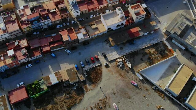 Drone shot backing over the roofs of some buildings in Spain.