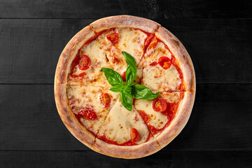 Pizza Margherita with pelati sauce, mozzarella, tomatoes and basil