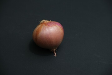 Single Onion isolated on black background