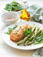 Baked Delicious salmon, green asparagus on  plate