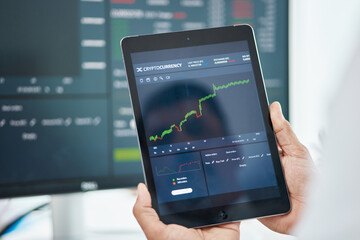 Tablet, stock market and trading with hands of man in office for investment graph, cryptocurrency...