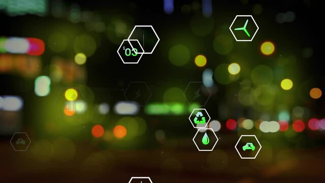 Animation of multiple digital icons against blurred view of night city traffic