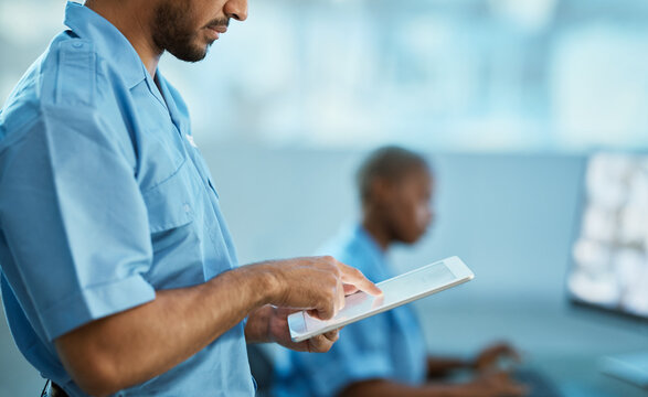 Man, Hands And Security Guard On Tablet For Surveillance, Search Or Browsing At The Office. Male Person, Law Enforcement Or Officer Working On Technology For Emergency Check Or Safety Inspection