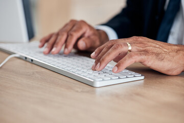 Hands, keyboard and a business man typing while working on a computer in his office for management....