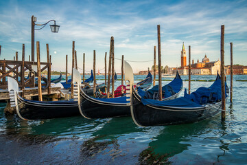 Gondolas are the symbol of Venice and the San Giorgio Maggiore church in the back