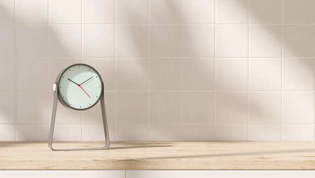 Modern, stylish analogue silver clock on wood countertop kitchen white cabinet counter in sunlight, leaf shadow on white square tile wall for fashion, beauty, lifestyle product display background 3D