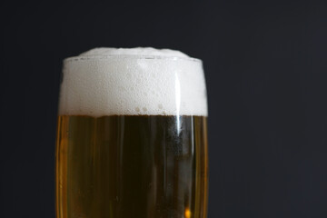 Beer with foam for drinking photographed in studio