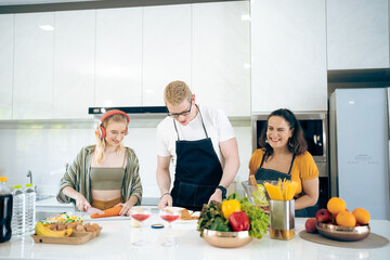 Happy family activity with food together, Portrait of smiling mother and children standing at cooking counter preparing ingredient for dinner meal, Lovely cute family making food at home kitchen