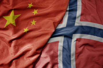big waving national colorful flag of china and national flag of norway .