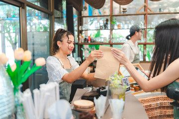 Smiling waitress wear apron take order talk to clients serving restaurant guests choosing food drinks menu in cafe coffeehouse bar, waiting staff, good customer service, cashier serving customers