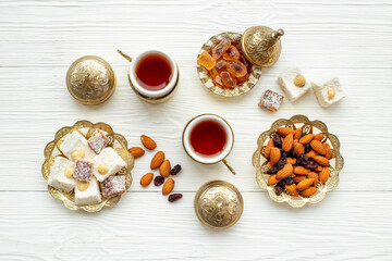 Arab style tea table with tea and sweets. Muslim holiday background