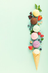 Flying ice cream balls and ingredients on pastel light blue background