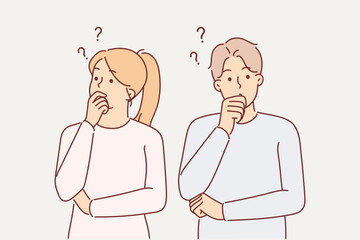 Thoughtful couple touches their chins in embarrassment when pondering important question