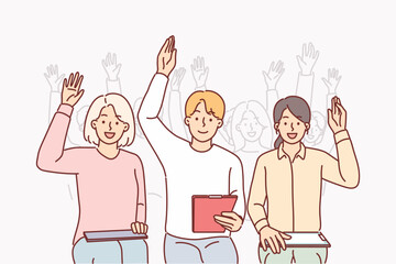 Group of people raise hands sitting in conference room and participating in business training
