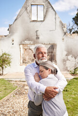 Couple, home in ruins after fire and hug at accident, disaster or crisis with hope and support with...