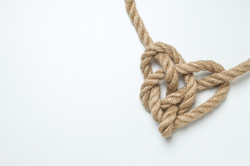 Celtic knot in the shape of a rope heart. Concept of creative unity, faith and protection. Place for text