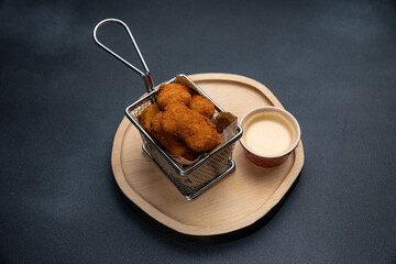 chicken nuggets on a wooden board