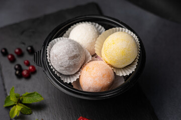 Japanese national dessert - mochi on a dark background
