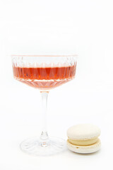 Macaroon and wine on a light background.