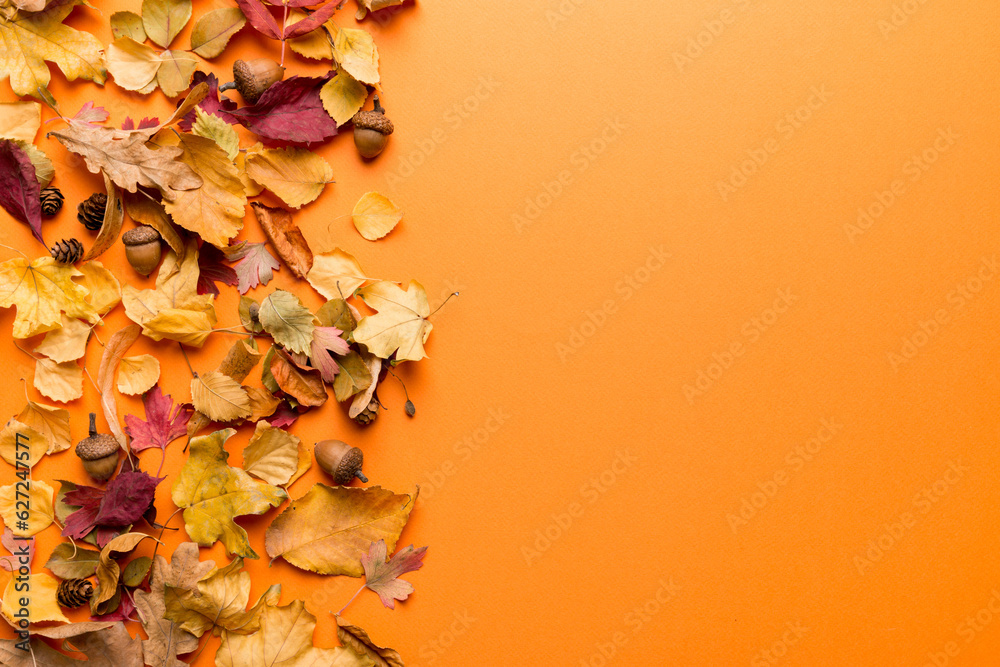 Wall mural autumn composition. pattern made of dried leaves and other design accessories on table. flat lay, to