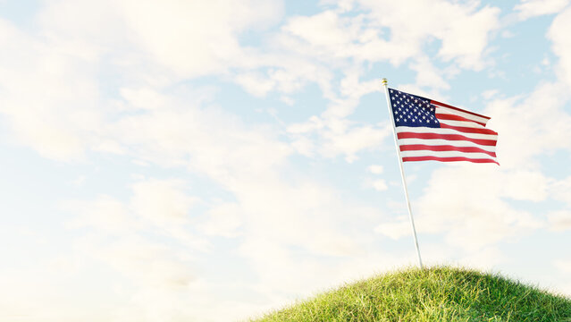 La bandera de Estados Unidos de Am&eacute;rica izada sobre un noble m&aacute;stil blanco, el cual est&aacute; erguido sobre una preciosa colina de fresco c&eacute;sped, y que ondea en un precios d&iacute;a de verano.