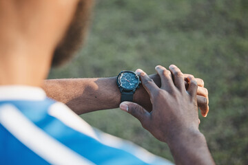Hands, man or soccer player with smart watch on field to monitor time, training or exercise progress. Wellness, performance or healthy sports athlete with timer to check running workout or fitness © Wesley JvR/peopleimages.com