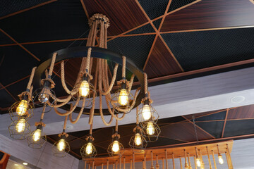 Vintage rope chandelier light on the wall 