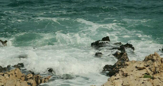 Jugo wind and waves on the rocky coast of the Adriatic Sea, Croatia