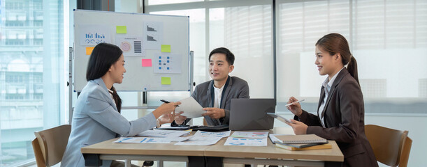 Asian business adviser meeting to analyze and discuss the situation on the financial report in the meeting room. Investment Consultant, Financial advisor and accounting concept