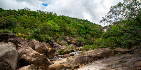 panorama of jourama falls in paluma range national park, north queensland, australia; cascade of numerous powerfull tropical waterfalls near townsville and ingham