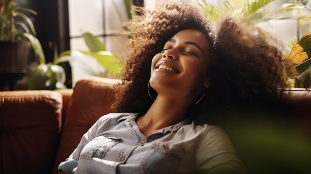 Happy Afro American woman relaxing on the sofa at home,Healthy life style, good vibes people and new home concept