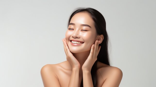 photo charming relaxed and gentle young woman making cosmetological procedure applying facial cream on face