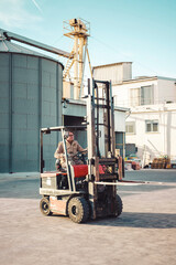 worker driving a lifting machine