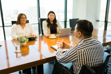 Disabled person giving job interview at office