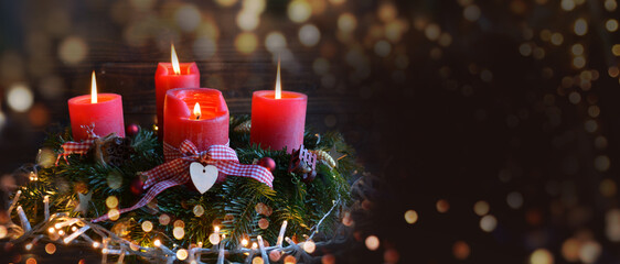 Christmas background with four red burning advent candles on fir tree wreath - banner, header,...
