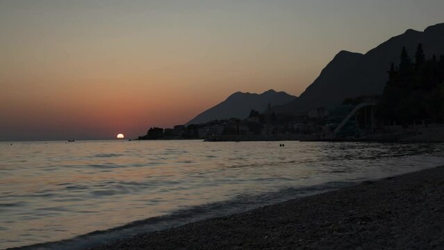 Spectacular sunset at Croatian small town Gradac in Dalmatia - time lapse 