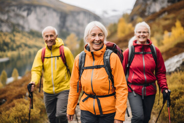 A group of elderly people walk along a tourist path in the mountains. Active lifestyle for old people in retirement. Generative ai.
