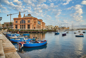 Fototapeta premium Margherita Theater and fishing boats in old harbor of Bari, Italy. Bari is the capital city of the Metropolitan City of Bari on the Adriatic Sea, Italy. Architecture and landmark of Italy