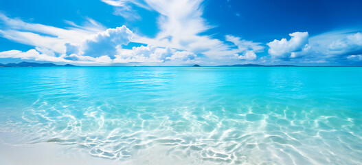 A tropical ocean scene with sand, sun with blue sky. Paradise island concept.