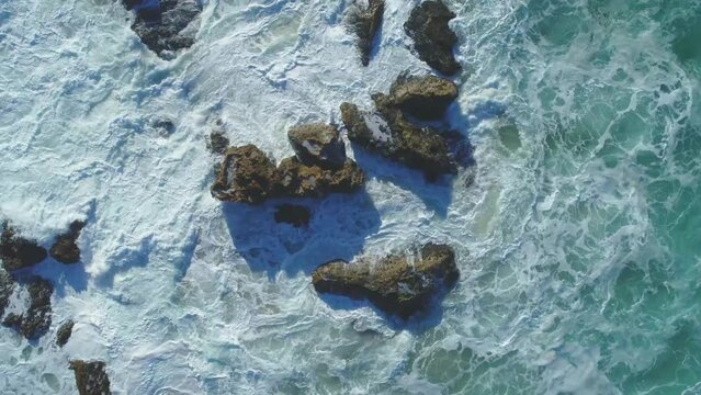 Aerial view of waves crashing on rocks at the Atlantic west coast of Portugal